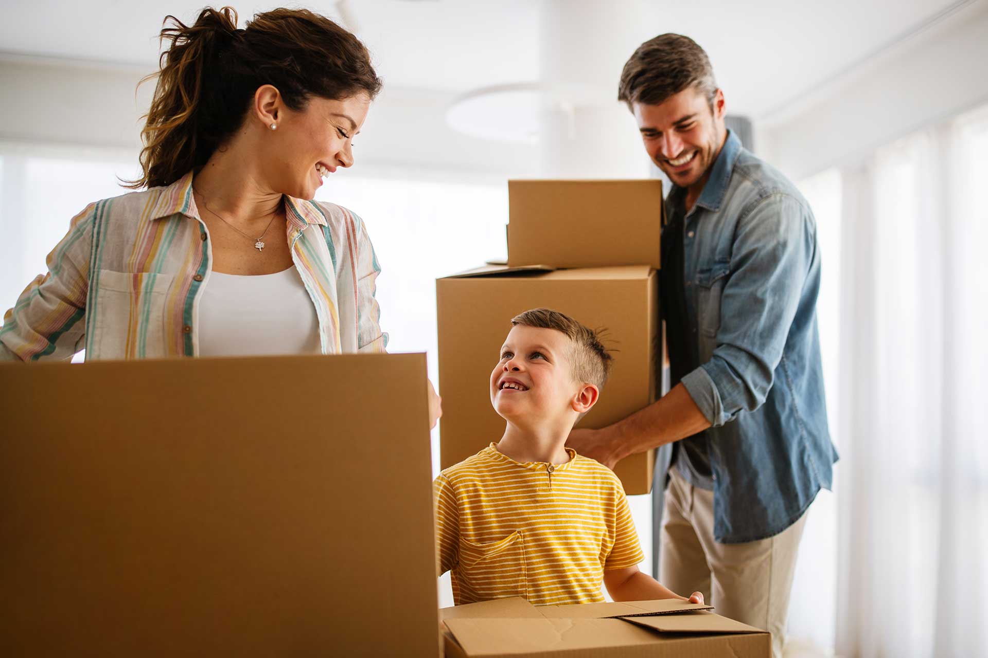 Family unpacking boxes in new home | Home Insurance | D&W Insurance Brokers Ireland